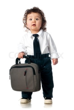 3886811-child-dressed-in-a-business-with-a-bag